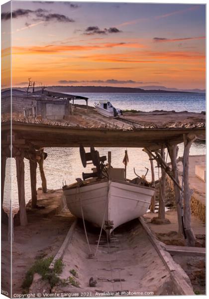 Fishing boat on its jetty at sunset Canvas Print by Vicente Sargues