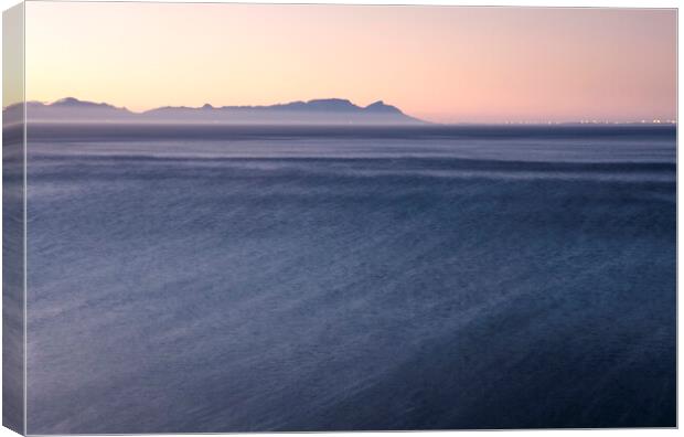 Cape Town at sunset over False Bay, South Africa Canvas Print by Neil Overy