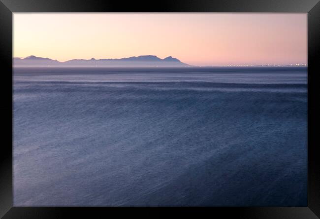 Cape Town at sunset over False Bay, South Africa Framed Print by Neil Overy