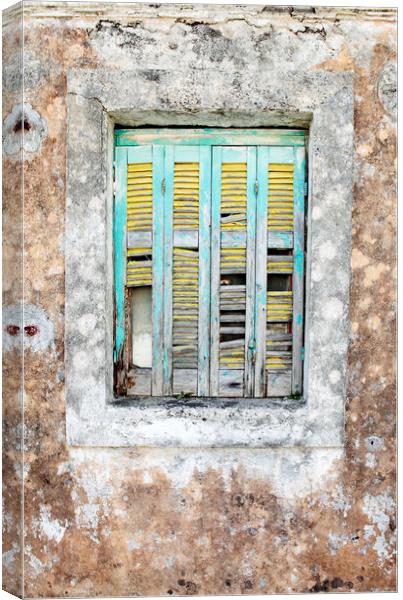 Old wooden shuttered window in Lesvos, Greece Canvas Print by Neil Overy