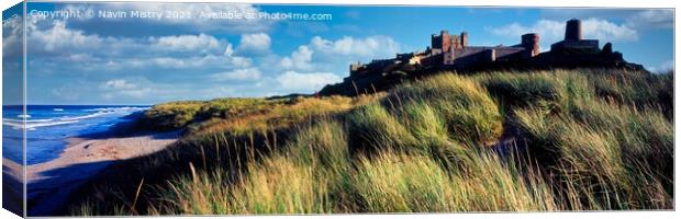 A view of Bamburgh Castle and the sand dunes, Northumberland Canvas Print by Navin Mistry