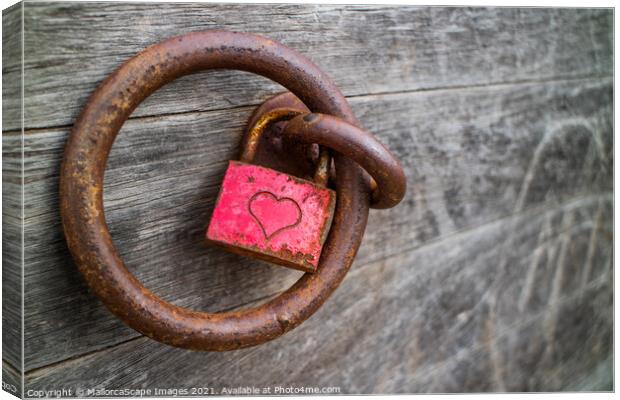 rusty padlock with a heart Canvas Print by MallorcaScape Images