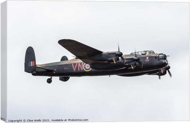 Lancaster flypast Canvas Print by Clive Wells