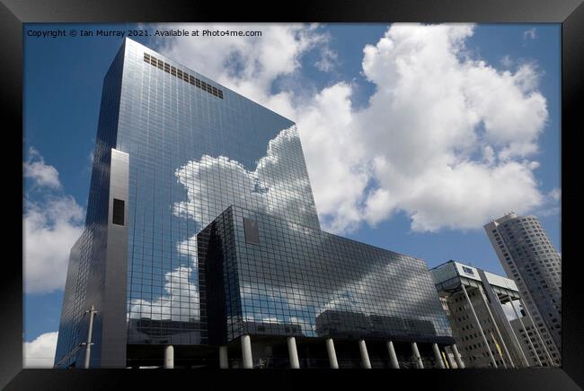 Clouds and modern offices in Rotterdam Framed Print by Ian Murray