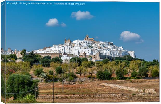 Hilltop town of Ostuni in Puglia, Southern Italy Canvas Print by Angus McComiskey