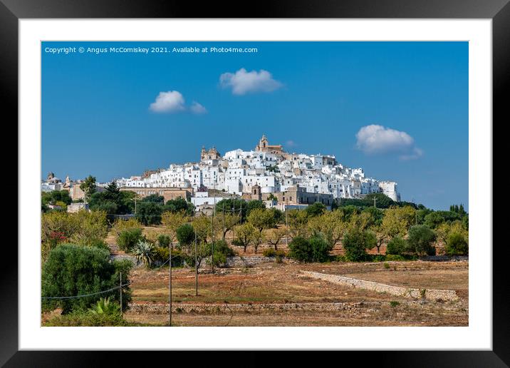 Hilltop town of Ostuni in Puglia, Southern Italy Framed Mounted Print by Angus McComiskey