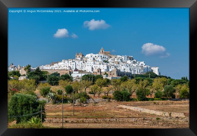Hilltop town of Ostuni in Puglia, Southern Italy Framed Print by Angus McComiskey