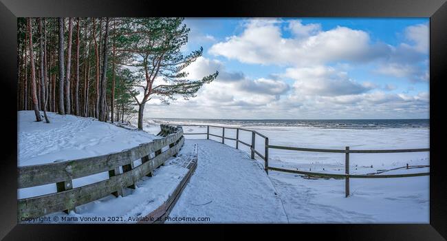 Winter snow covered Baltic sea coast Framed Print by Maria Vonotna