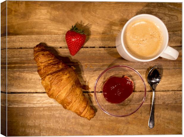 Breakfast table with coffee croissants and jam Canvas Print by Erik Lattwein