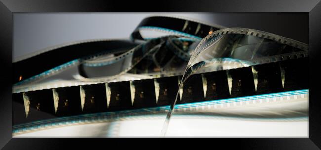 Close Up view of a 35mm film strip - macro shot Framed Print by Erik Lattwein