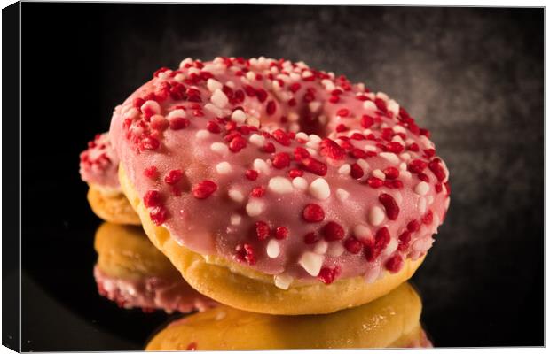 Sweet doughnuts in close-up view - macro shot Canvas Print by Erik Lattwein