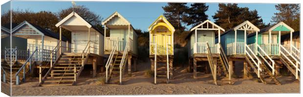 Colorful wells next the sea beach huts England Canvas Print by Sonny Ryse