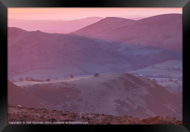 Sunrise from the Long Mynd over the Shropshire Hil Framed Print by Alan Dunnett