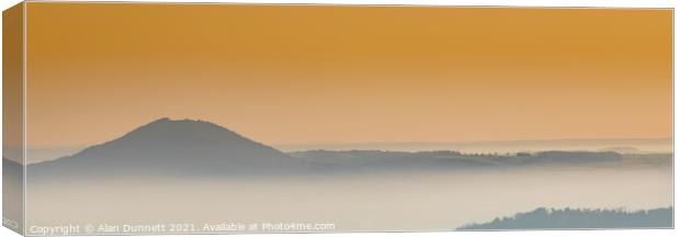 Sunrise mist in the valley Canvas Print by Alan Dunnett