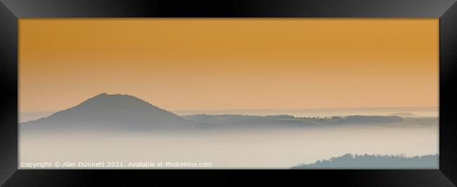 Sunrise mist in the valley Framed Print by Alan Dunnett