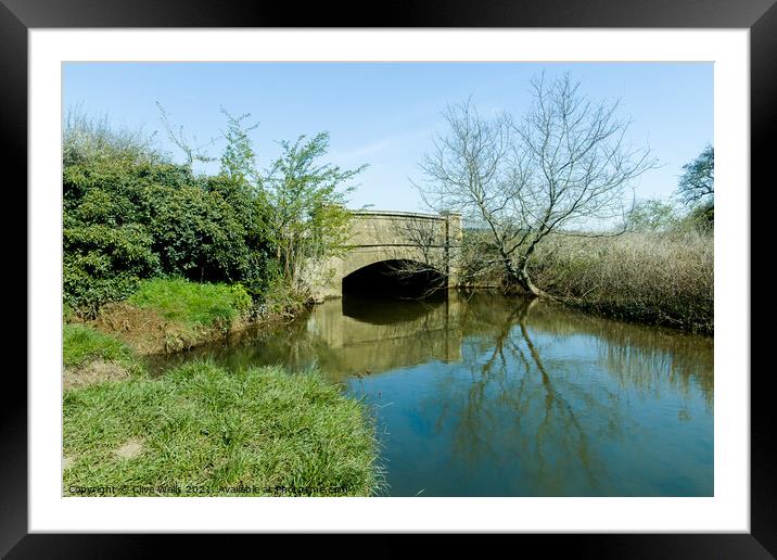 Calm water under the bridge. Framed Mounted Print by Clive Wells