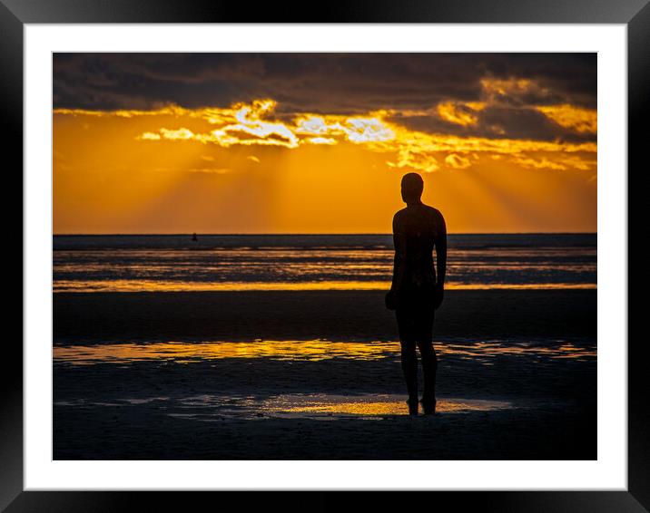 Anthony Gormley Statue standing on a beach in fron Framed Mounted Print by Vicky Outen