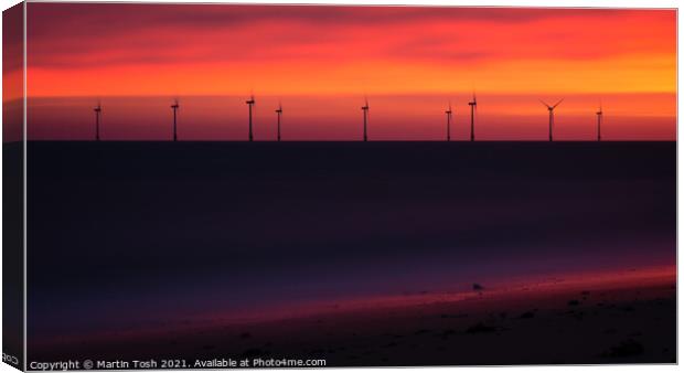 Electric. Orange dawn with wind farm and beach Canvas Print by Martin Tosh