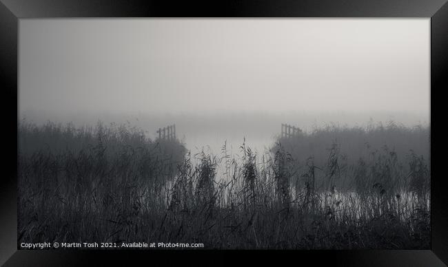 Waterways. Reeds and fences in misty Norfolk Broads Framed Print by Martin Tosh
