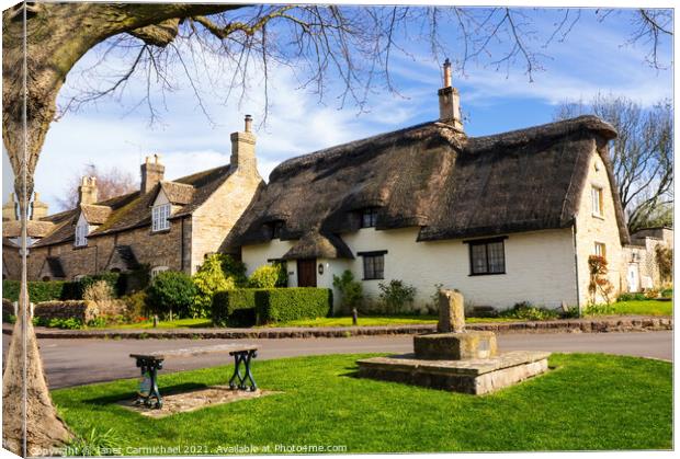 A Medieval English Village Oasis Canvas Print by Janet Carmichael