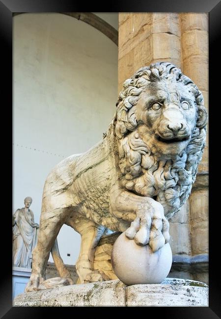 Florence, Tuscany, Italy: ancient statue of a lion in Piazza della Signoria, sculpture that depicts a lion with a sphere under one paw Framed Print by M. J. Photography