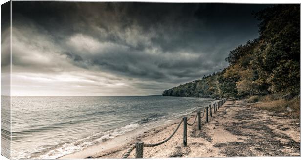 Dark Skies over the beach Canvas Print by Ian Johnston  LRPS