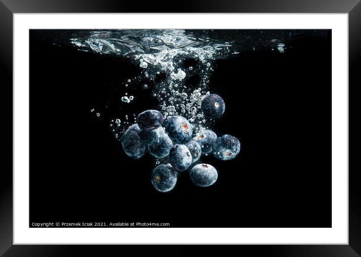 Blueberries splashing in water on black Framed Mounted Print by Przemek Iciak