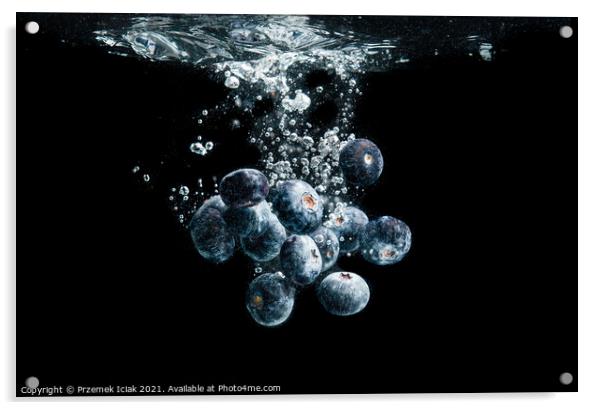 Blueberries splashing in water on black Acrylic by Przemek Iciak