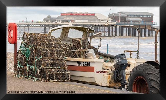 Crab pots and fishing boat on Cromer beach Framed Print by Chris Yaxley