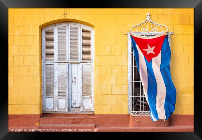 Cuban flag in in a street of Trinidad, Cuba Framed Print by Delphimages Art