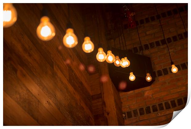 Light bulbs in trendy restaurant Print by Elijah Lovkoff