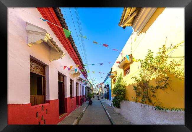 Colombia, Scenic colorful streets of Cartagena in historic Getsemani district near Walled City, Ciudad Amurallada, a UNESCO world heritage site Framed Print by Elijah Lovkoff