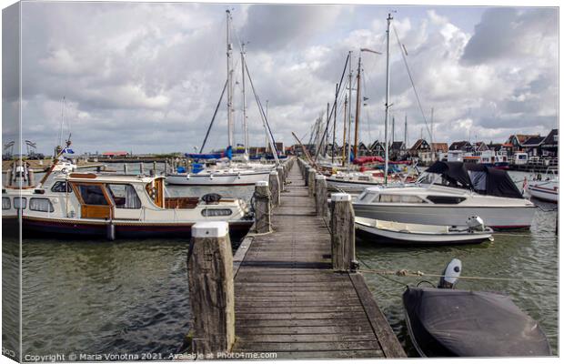 Pier with boats and yachts in Marken, Netherlands Canvas Print by Maria Vonotna