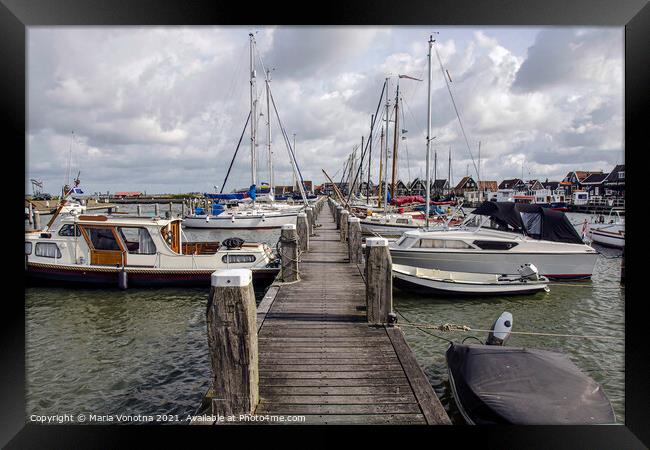 Pier with boats and yachts in Marken, Netherlands Framed Print by Maria Vonotna
