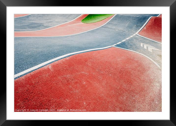 Detail of the asphalt and the white lines of a pumptrack circuit Framed Mounted Print by Joaquin Corbalan