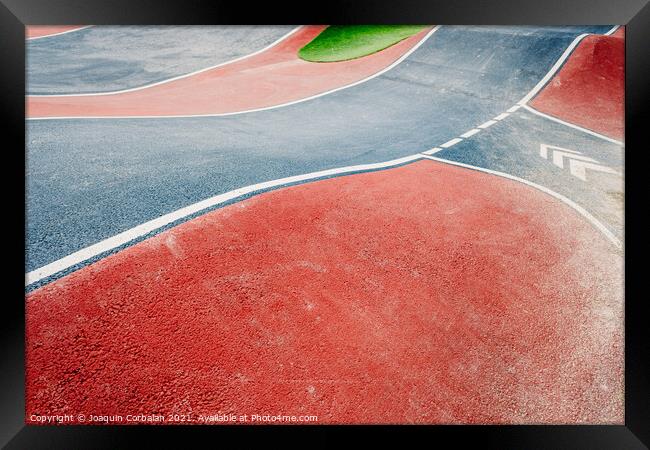 Detail of the asphalt and the white lines of a pumptrack circuit Framed Print by Joaquin Corbalan
