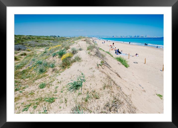 Valencia, Spain - April 21, 2021: Vacationers on a beach, next t Framed Mounted Print by Joaquin Corbalan