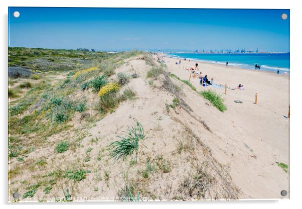 Valencia, Spain - April 21, 2021: Vacationers on a beach, next t Acrylic by Joaquin Corbalan