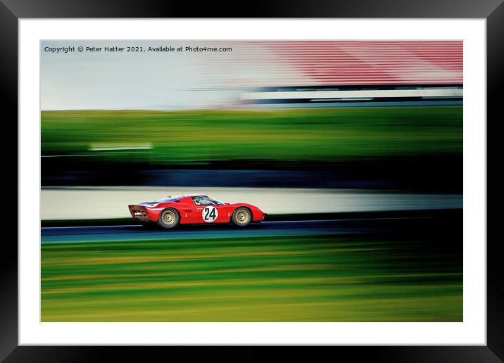 A fast red car on a track. Framed Mounted Print by Peter Hatter