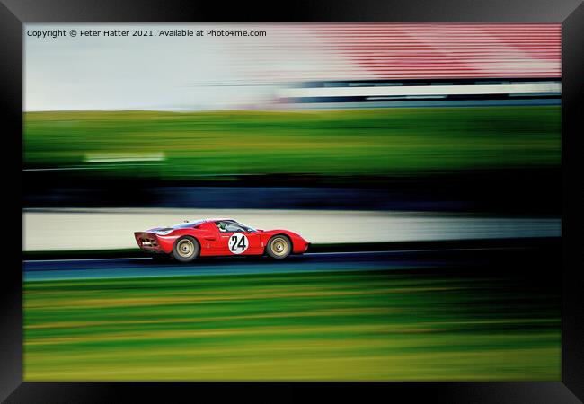 A fast red car on a track. Framed Print by Peter Hatter