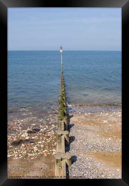 Groyne sea defence going out to sea Framed Print by Clive Wells