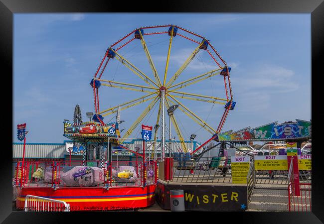 The Big Wheel at the fun fair Framed Print by Clive Wells
