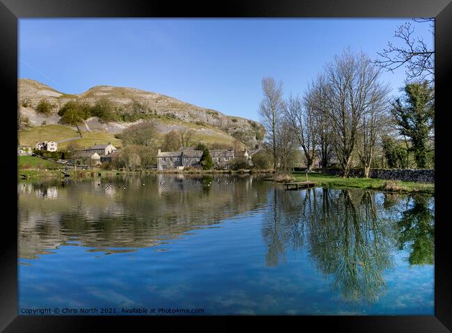 Kilnsey Trout Farm Lake with Kilnsey Crag in the background. Framed Print by Chris North