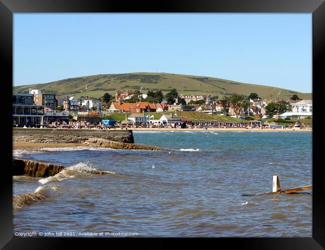 Swanage bay and seafront in Dorset, UK. Framed Print by john hill