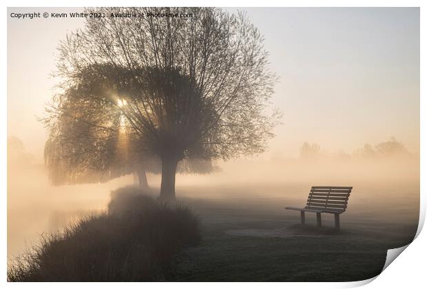 Bench beside misty lake Print by Kevin White