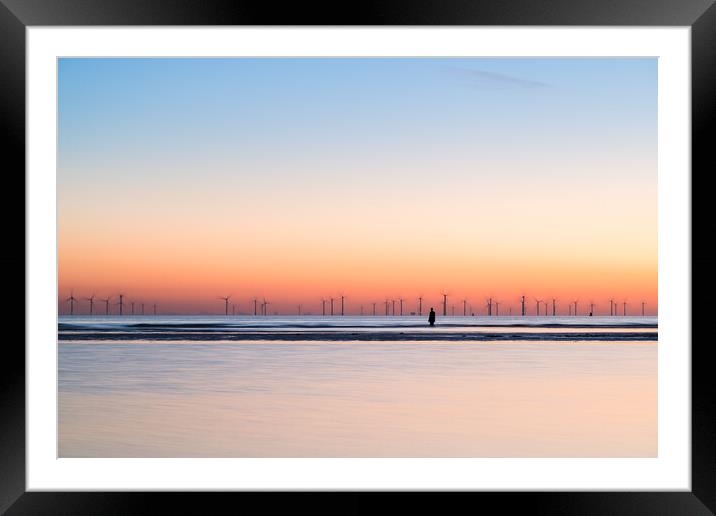 Iron Man watches the spinning wind turbines Framed Mounted Print by Jason Wells