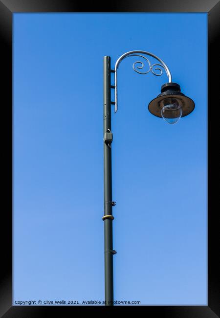 Single street lamp Framed Print by Clive Wells