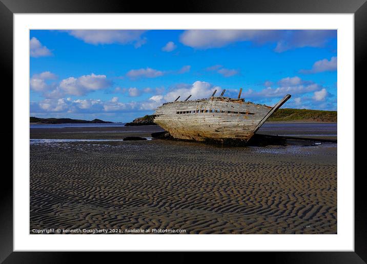 A shipwreck sitting on top of a sandy beach Framed Mounted Print by kenneth Dougherty