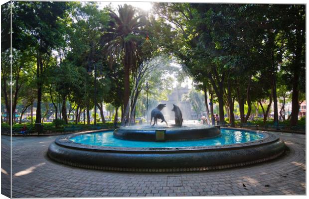 Coyoacan, Mexico City, Mexico, Drinking coyotes statue and fountain in Hidalgo Square in Coyoacan Canvas Print by Elijah Lovkoff