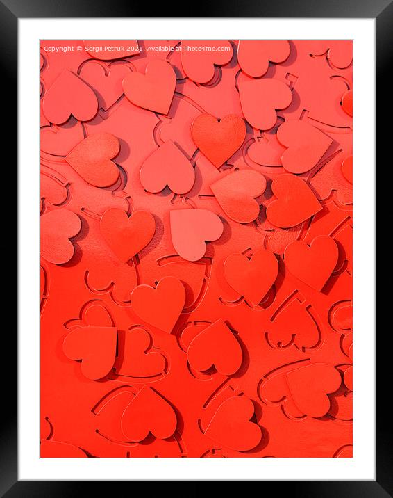 Red metal hearts setting as a symbol of love. Framed Mounted Print by Sergii Petruk
